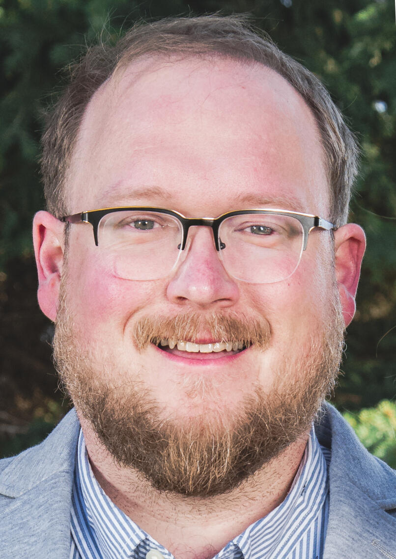 A headshot photo of Dustin Zick